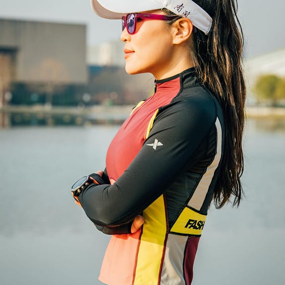 Woman standing wearing one of the best running watches